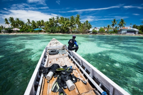 A divemaster, and one of the very few fishermen on Tomia working in ecotourism, returns from bringing a client out on a dive.